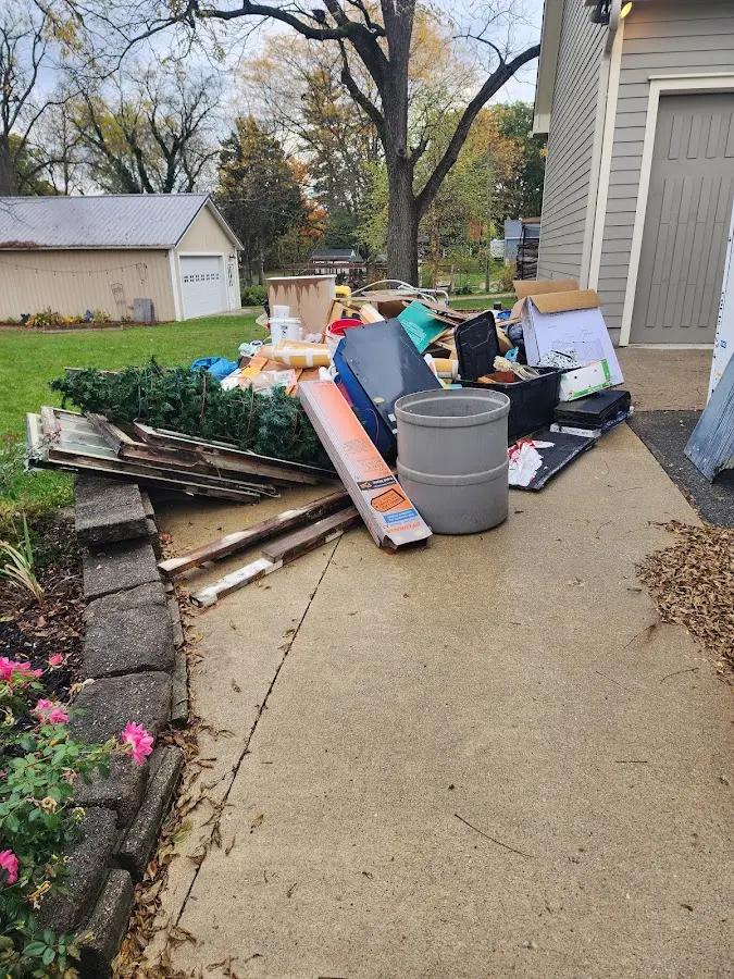 Dumpster being loaded with debris for 3 Yard Dumpster Rental in Easton